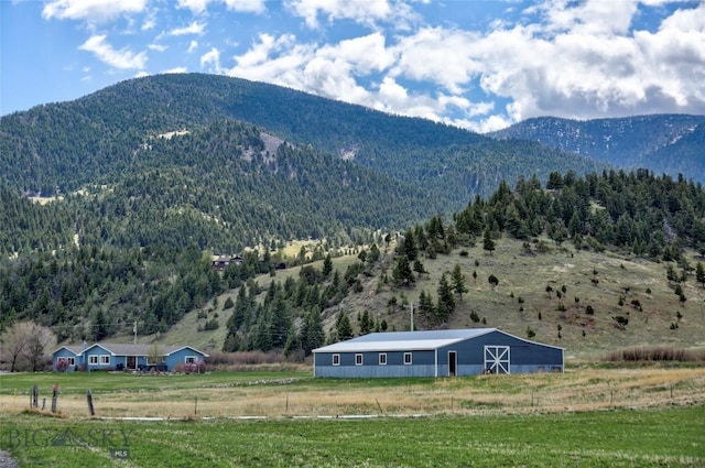 property view of mountains featuring a rural view and a wooded view