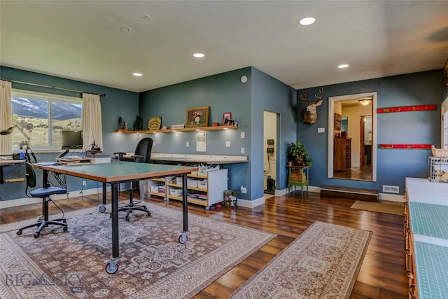 recreation room featuring wood finished floors, baseboards, visible vents, and recessed lighting