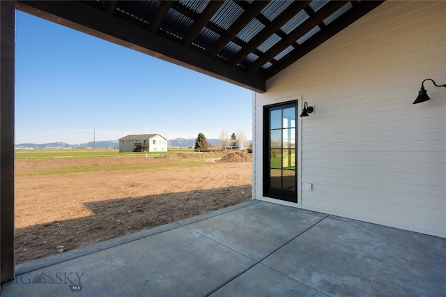 5680 Staffanson Rd, Bozeman, MT 59718 - view of patio / terrace with a mountain view