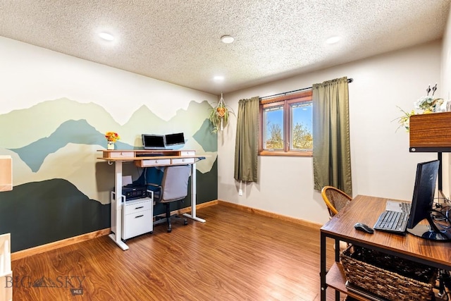 home office featuring a textured ceiling, recessed lighting, and wood finished floors