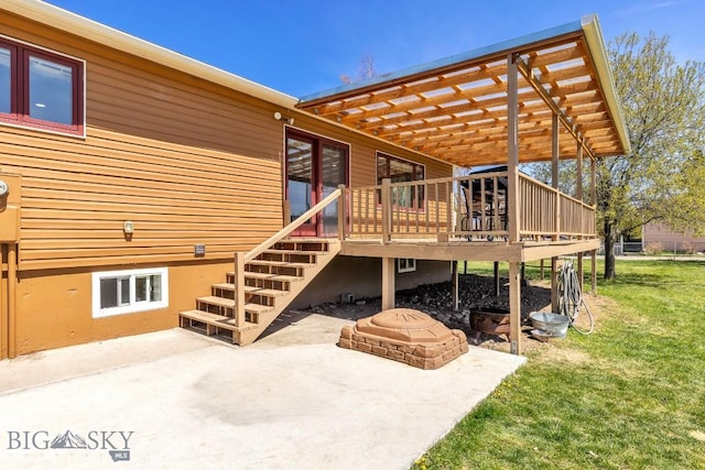 back of property featuring a yard, a patio, stairs, a pergola, and a wooden deck
