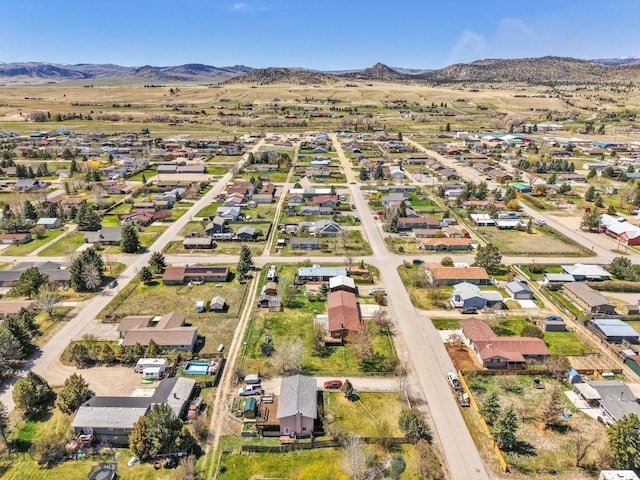 drone / aerial view featuring a mountain view and a residential view