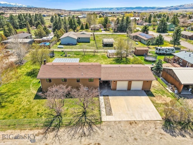 drone / aerial view with a mountain view and a residential view