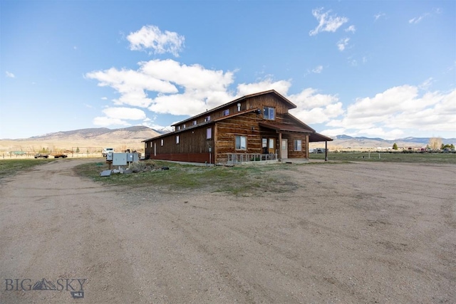 2 Dayspring Rd W, Sheridan, MT 59749 - view of property exterior with a mountain view, a porch, and a view of rural / pastoral area
