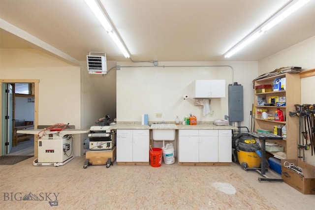 2 Dayspring Rd W, Sheridan, MT 59749 - garage with electric panel, a heating unit, and a workshop area
