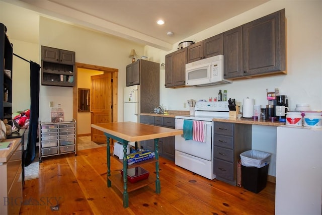 2 Dayspring Rd W, Sheridan, MT 59749 - kitchen with white appliances, hardwood / wood-style floors, dark brown cabinets, recessed lighting, and light countertops