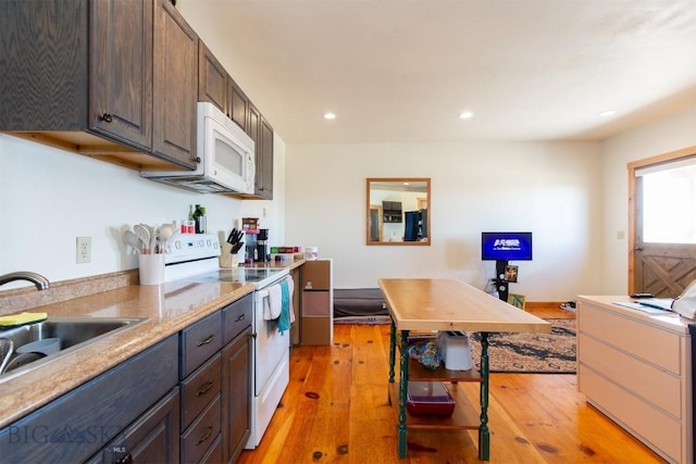 2 Dayspring Rd W, Sheridan, MT 59749 - kitchen featuring white appliances, light wood-style flooring, a sink, recessed lighting, and light countertops