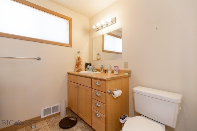 2 Dayspring Rd W, Sheridan, MT 59749 - bathroom with vanity, toilet, and tile patterned floors