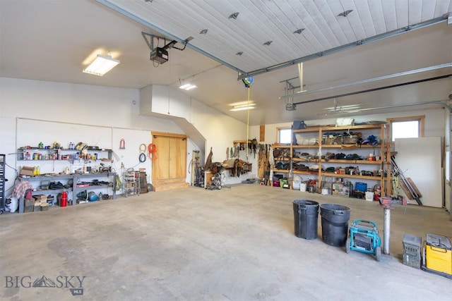 2 Dayspring Rd W, Sheridan, MT 59749 - garage with a garage door opener and a workshop area