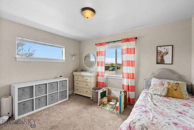 bedroom featuring carpet floors and baseboards