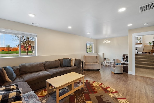 living room featuring wood finished floors, a chandelier, and recessed lighting