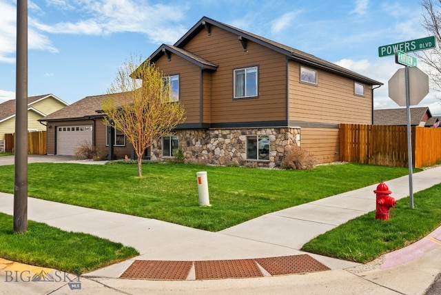 view of front facade featuring stone siding, an attached garage, and concrete driveway