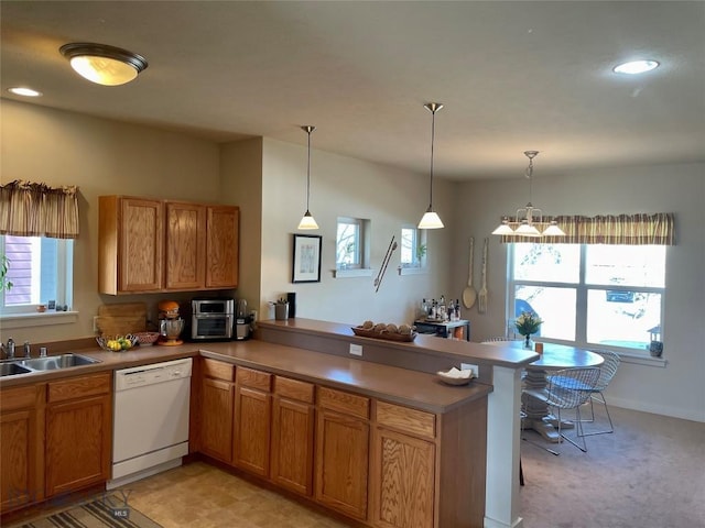 4277 W Babcock St Unit 6, Bozeman, MT 59718 - kitchen with white dishwasher, a peninsula, a sink, healthy amount of natural light, and recessed lighting