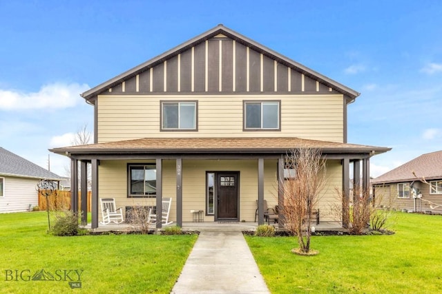 traditional style home featuring covered porch and a front lawn