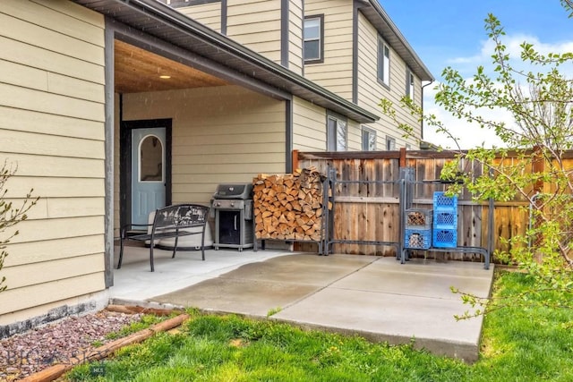 304 Farmall Ln, Manhattan, MT 59741 - view of patio featuring a grill, fence, and a gate
