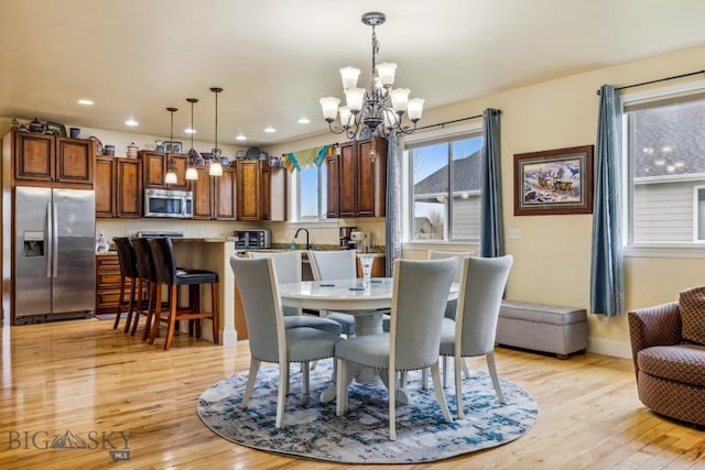 304 Farmall Ln, Manhattan, MT 59741 - dining room with a chandelier, light wood-style floors, recessed lighting, and baseboards