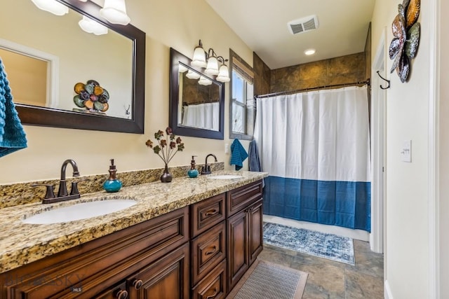 304 Farmall Ln, Manhattan, MT 59741 - bathroom with stone finish flooring, double vanity, and a shower with shower curtain