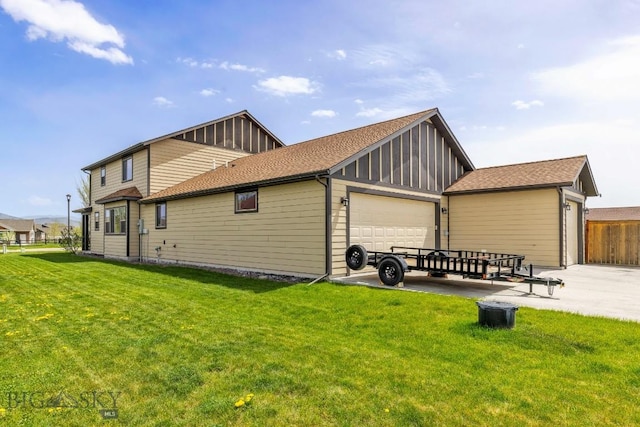 304 Farmall Ln, Manhattan, MT 59741 - rear view of house featuring board and batten siding and an attached garage
