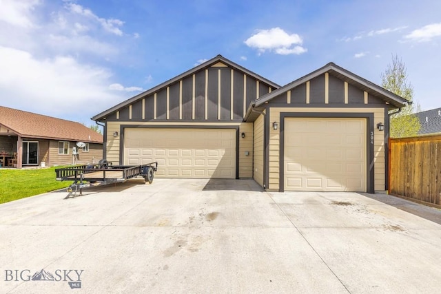 304 Farmall Ln, Manhattan, MT 59741 - view of front of property featuring board and batten siding, driveway, a garage, and fence
