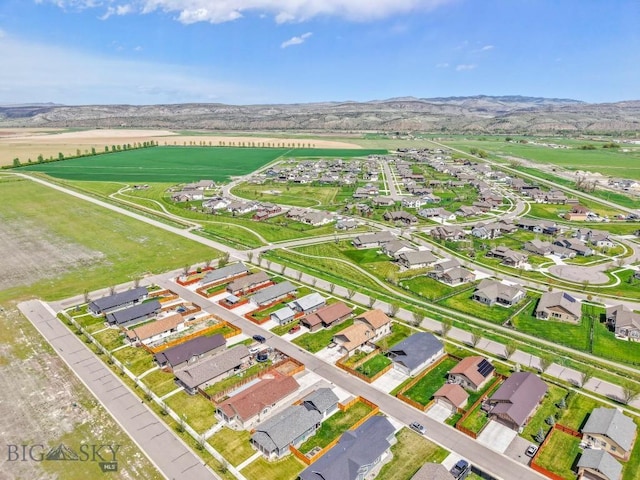 304 Farmall Ln, Manhattan, MT 59741 - aerial overview of property's location with a mountain backdrop and nearby suburban area