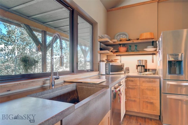 11762 Gooch Hill Rd, Gallatin Gateway, MT 59730 - kitchen with appliances with stainless steel finishes, a sink, open shelves, wood finished floors, and vaulted ceiling