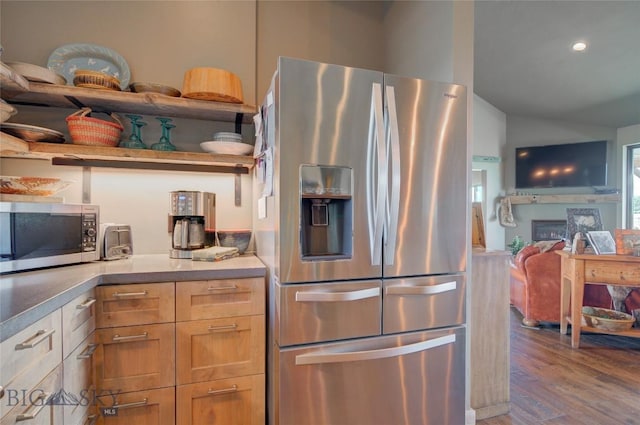 11762 Gooch Hill Rd, Gallatin Gateway, MT 59730 - kitchen with stainless steel appliances, open floor plan, wood finished floors, a fireplace, and lofted ceiling