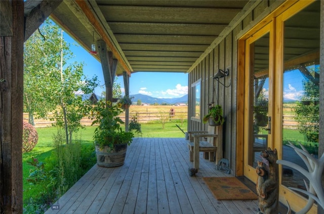 11762 Gooch Hill Rd, Gallatin Gateway, MT 59730 - wooden deck with a lawn and a mountain view