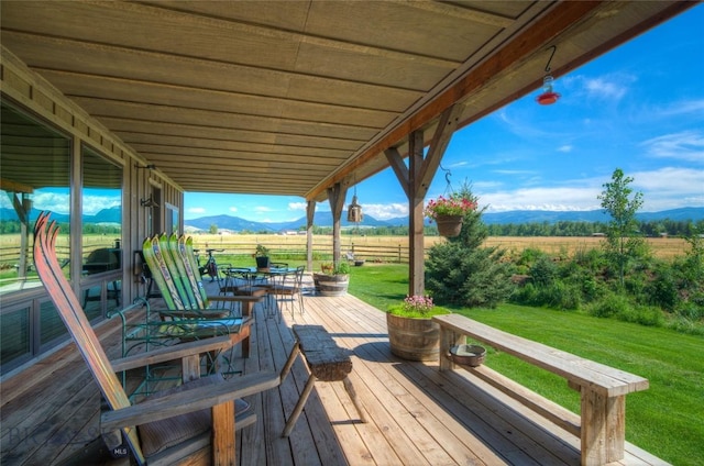 11762 Gooch Hill Rd, Gallatin Gateway, MT 59730 - deck featuring a mountain view, a yard, a rural view, and outdoor dining space