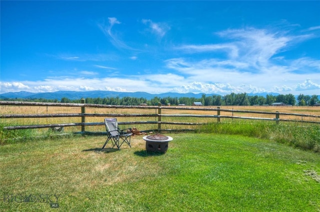 11762 Gooch Hill Rd, Gallatin Gateway, MT 59730 - view of yard featuring a rural view, a fire pit, and a mountain view