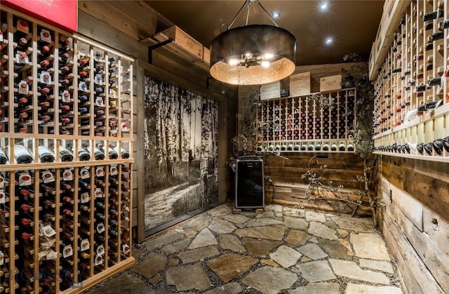 wine cellar featuring stone floors and recessed lighting