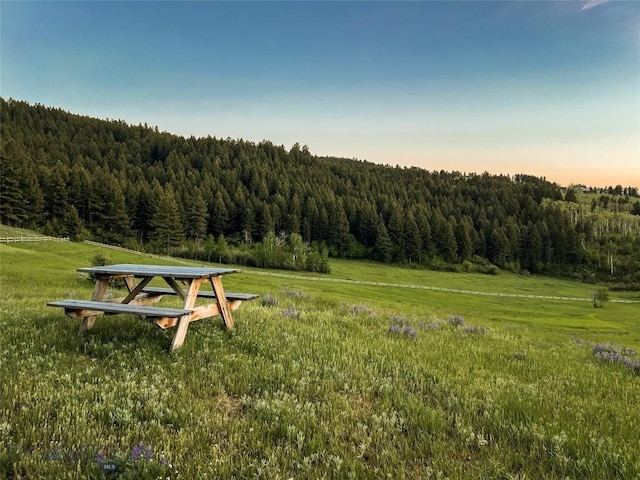 surrounding community with a forest view