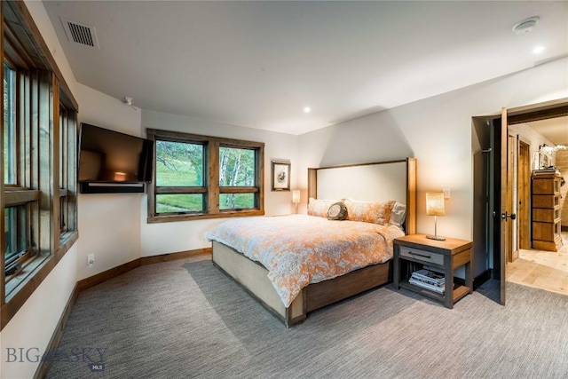 bedroom featuring carpet flooring and baseboards