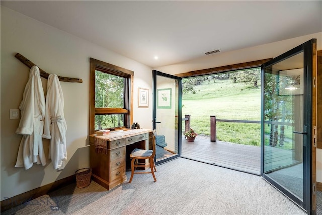 doorway featuring carpet