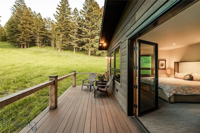 wooden deck featuring french doors and a yard