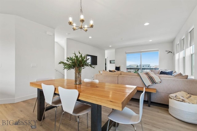 dining space featuring a chandelier, light wood-style flooring, recessed lighting, and baseboards
