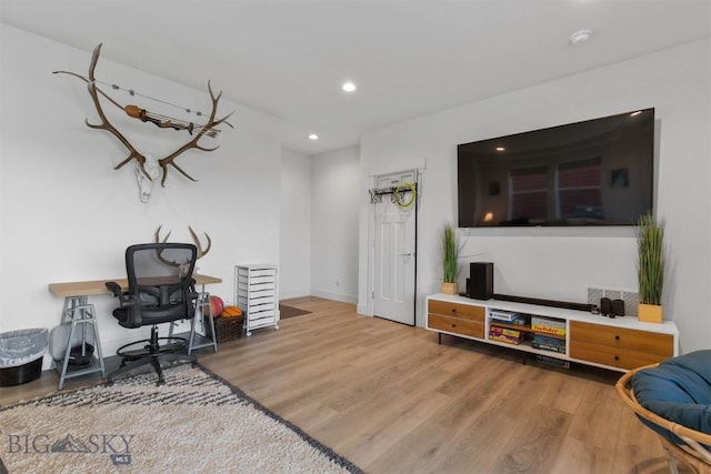 office space featuring wood finished floors, recessed lighting, and baseboards