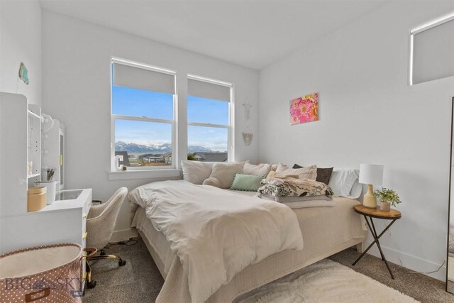 bedroom with carpet flooring and baseboards