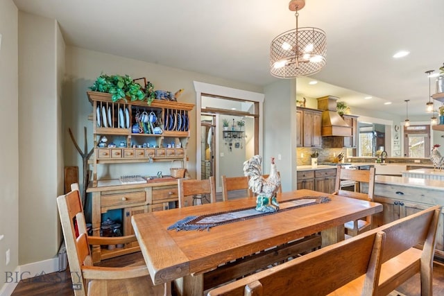 754 Milestone Dr, Belgrade, MT 59714 - dining space featuring recessed lighting, baseboards, a chandelier, and wood finished floors