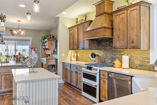 754 Milestone Dr, Belgrade, MT 59714 - kitchen with dishwasher, range with two ovens, a sink, backsplash, and recessed lighting