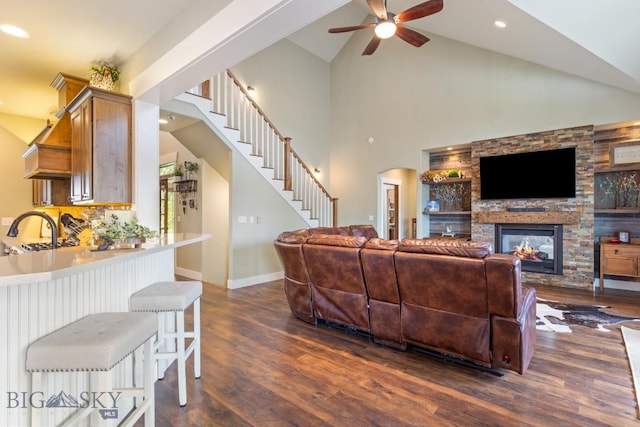754 Milestone Dr, Belgrade, MT 59714 - living room featuring dark wood finished floors, a ceiling fan, stairs, high vaulted ceiling, and recessed lighting