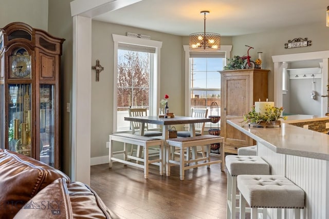 754 Milestone Dr, Belgrade, MT 59714 - dining area with dark wood-style flooring, baseboards, and a chandelier