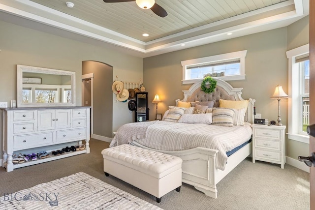754 Milestone Dr, Belgrade, MT 59714 - bedroom with wooden ceiling, light carpet, multiple windows, arched walkways, and recessed lighting