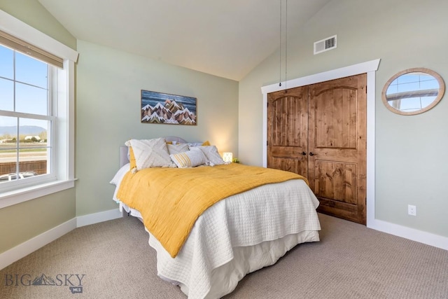 754 Milestone Dr, Belgrade, MT 59714 - bedroom with vaulted ceiling, multiple windows, light colored carpet, and baseboards