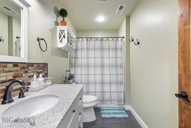 754 Milestone Dr, Belgrade, MT 59714 - full bath with toilet, vanity, a shower with shower curtain, baseboards, and recessed lighting