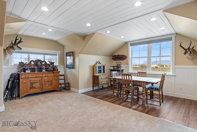 754 Milestone Dr, Belgrade, MT 59714 - carpeted dining area with lofted ceiling, a wainscoted wall, recessed lighting, and wood finished floors