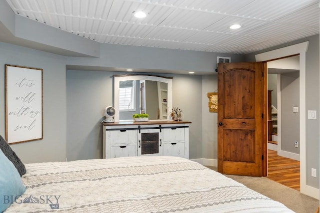 754 Milestone Dr, Belgrade, MT 59714 - carpeted bedroom featuring recessed lighting, baseboards, and wood finished floors