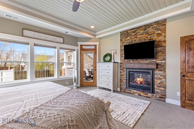 754 Milestone Dr, Belgrade, MT 59714 - carpeted bedroom featuring a fireplace, baseboards, wood ceiling, access to exterior, and recessed lighting