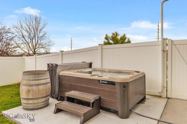 754 Milestone Dr, Belgrade, MT 59714 - view of patio / terrace featuring fence and a hot tub