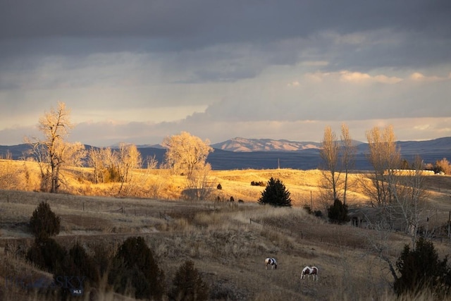 view of mountain backdrop featuring rural landscape