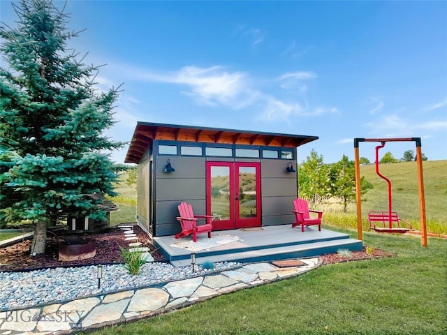 view of outdoor structure with an outbuilding and french doors